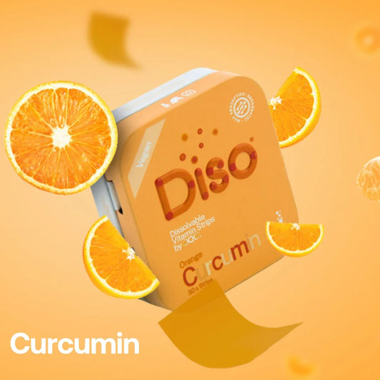 Tin of Diso Curcumin with orange slices on an orange background